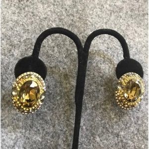 Heidi Daus oval smokey brown, clear, and gold crystal earrings.